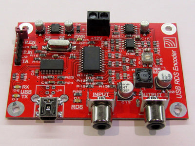 USB Scrolling RDS Encoder module Ver.2 showcasing its compact design and USB connection for easy programming in FM transmitter projects.